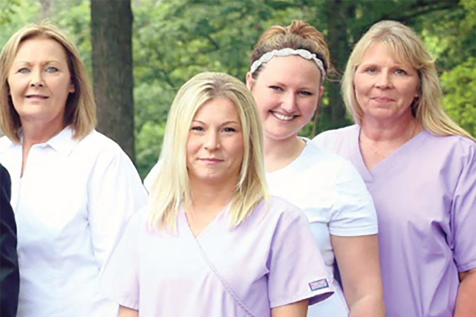 members of the Hage Orthodontics team smiling for the camera